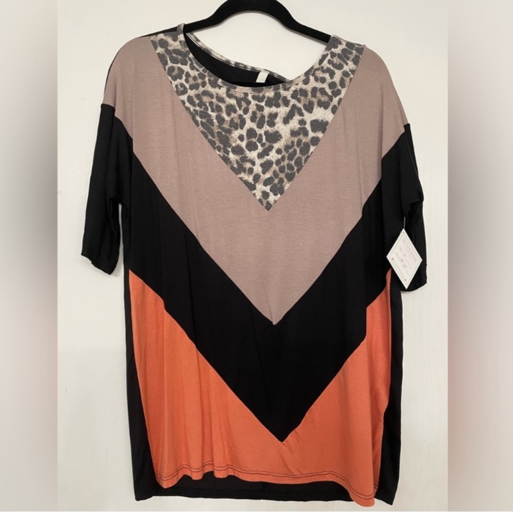Celeste mixed print top. Size Medium.